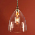Margate Small Ribbed Glass Shade Pendant Light with hand-blown ribbed glass and vintage filament bulb against warm background