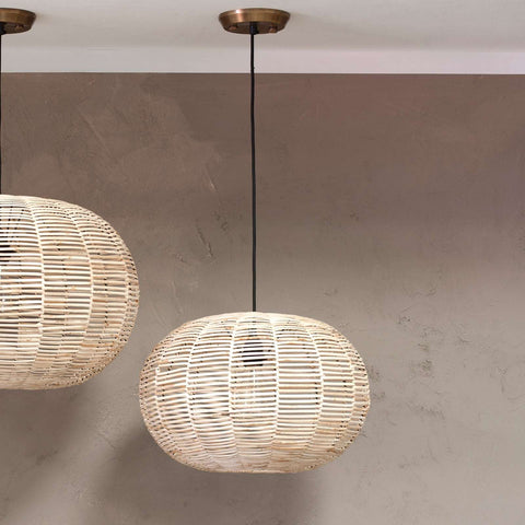 Nkuku Noko Wicker small round pendant light with natural woven wicker globe design hanging from ceiling