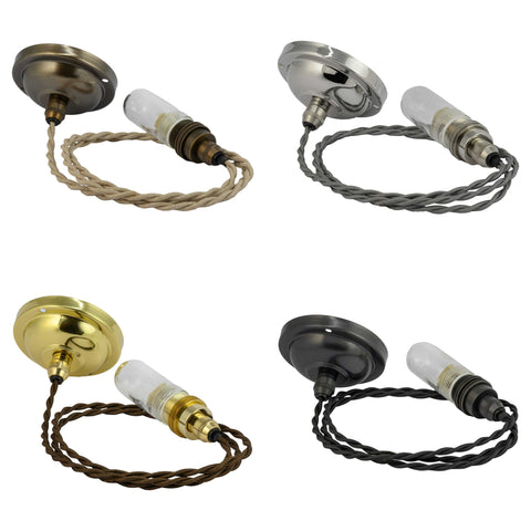 Four Bodium medium clear glass shade bathroom pendant lights in different finishes with twisted cords and vintage-style bulbs