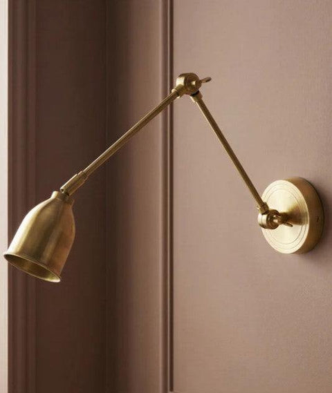 Pooky Pick Brass Wall Light with adjustable brass arm and solid brass hood, ideal for bedside reading, task lighting, and stylish interior wall illumination.
