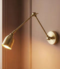 Pooky Pick Brass Wall Light with adjustable brass arm and solid brass hood, ideal for bedside reading, task lighting, and stylish interior wall illumination.