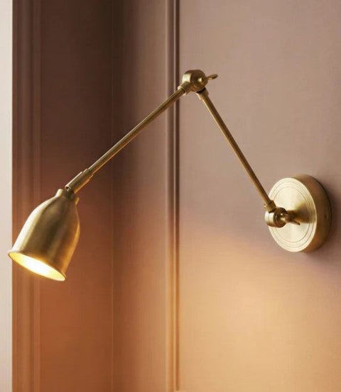 Pooky Pick Brass Wall Light with adjustable brass arm and solid brass hood, ideal for bedside reading, task lighting, and stylish interior wall illumination.