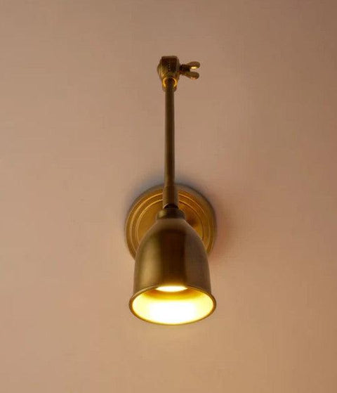 Pooky Pick Brass Wall Light with adjustable brass arm and solid brass hood, ideal for bedside reading, task lighting, and stylish interior wall illumination.