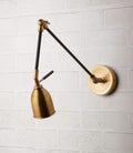 Pooky Pick Brass Wall Light with adjustable brass arm and solid brass hood, ideal for bedside reading, task lighting, and stylish interior wall illumination.