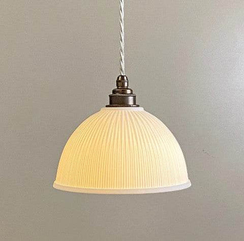 Denton Medium Ribbed ceramic pendant light handcrafted in UK with porcelain shade and soft light diffusion