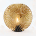 Salcombe glass cordless table lamp with seashell-inspired multifaceted design and warm diffused glow