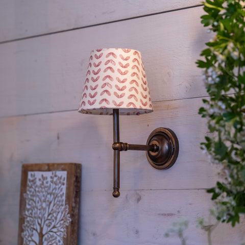 Finberry fabric shade Lupin wall light with patterned fabric shade and bronze finish on wooden wall