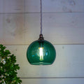 Soho Small teal hand-blown glass globe pendant light hanging in minimalist interior