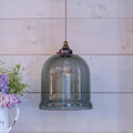 Hythe Medium Smoked Glass Shade pendant light with adjustable flex and smoky grey glass shade hanging in a modern room.
