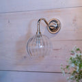 Soho Small Ribbed Glass shade bathroom wall light with chrome mount on wooden wall