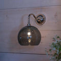 Soho Medium Smoked Glass Shade bathroom wall light with chrome fixture illuminating softly