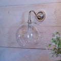 Soho large clear glass bathroom wall light with chrome finish mounted on wooden wall
