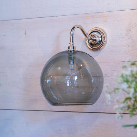 Soho Large Smoked Glass bathroom wall light with round smoked glass shade and chrome finish mount on wooden wall