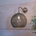 Soho Large Smoked Glass bathroom wall light with chrome finish and round smoked glass shade mounted on wooden wall