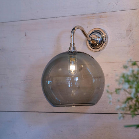 Soho Large smoked glass shade bathroom wall light with chrome finish mounted on wooden wall