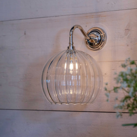 Soho large ribbed glass shade bathroom wall light with chrome finish mounted on wooden wall