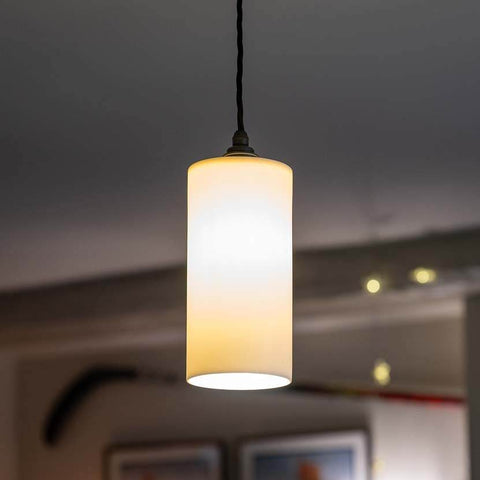 Stockwell Large Ceramic Shade Pendant Light with smooth cylindrical ceramic shade illuminating modern interior space