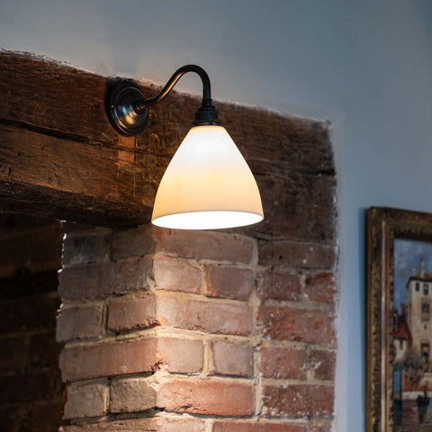 Langton Ceramic Shade Wall Light mounted on a fireplace with a swan neck