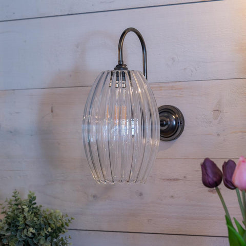 Camber Large ribbed Glass Shade Wall Light with ribbed glass shade and swan neck arm in antique brass finish