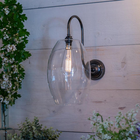 Camber Large Clear Glass Shade Wall Light with ribbed glass shade and swan neck arm in antique brass finish