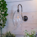 Camber Large Clear Glass Shade Wall Light with ribbed glass and swan neck arm in antique brass finish