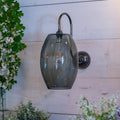 Camber Large Smoked Glass Wall Light with antique brass swan neck arm and transparent smoked shade