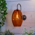 Camber Large Amber Glass Wall Light with amber glass shade and swan neck arm in antique brass finish