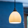Stanford Ceramic Shade Pendant Light with smooth rounded ceramic design and warm ambient glow