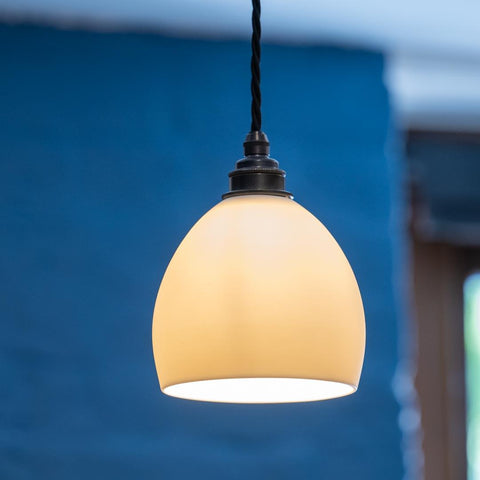 Stanford ceramic shade pendant light with smooth rounded ceramic design and warm glow