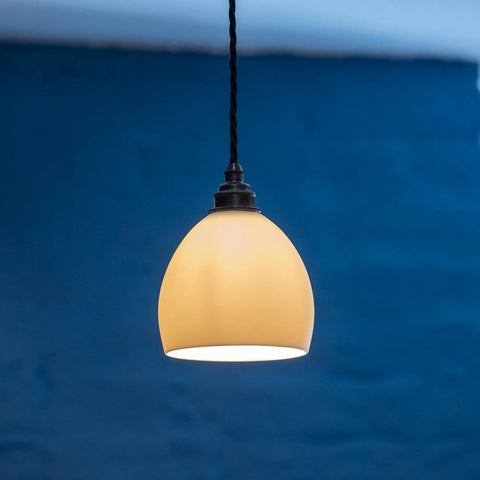 Stanford Ceramic Shade pendant light with smooth rounded design and warm glow