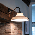 Hartington Ceramic Shade Wall Light with ribbed ceramic shade on swan neck arm providing soft warm glow