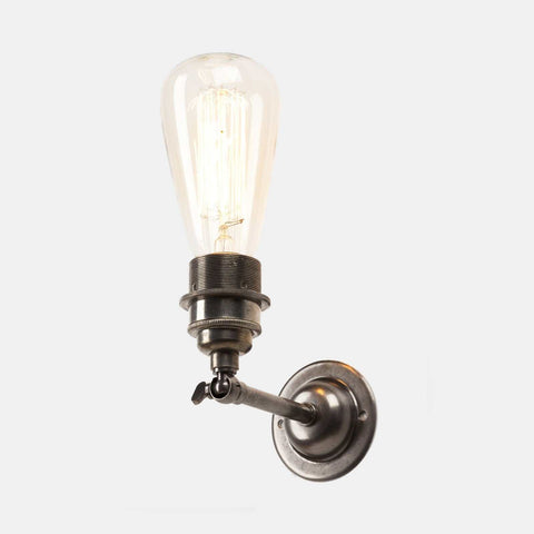 Kennet Adjustable Wall industrial-style metal wall light with exposed Edison bulb and adjustable arm in antique silver finish