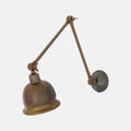 Dale Adjustable Wall Light with three pivot points and a vintage brass finish for versatile accent lighting