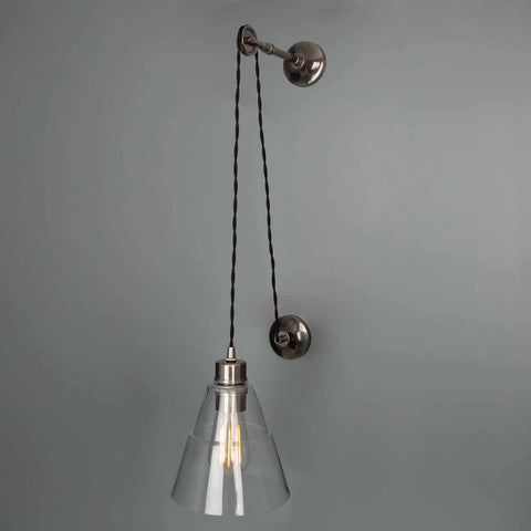Kairi Pulley Wall Light with clear glass shade and adjustable black pulley cable in an industrial vintage design