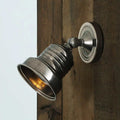 Newell Spot Light adjustable solid brass wall light in antique silver finish mounted on wooden wall