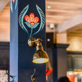 Moorlea Brass Wall Light vintage adjustable brass wall sconce with warm ambient light in stylish industrial design