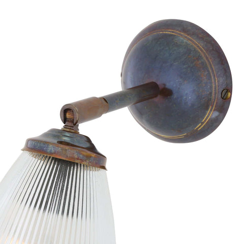 Gadar Adjustable Wall Light with rusted metal finish and prismatic glass shade for modern industrial interiors