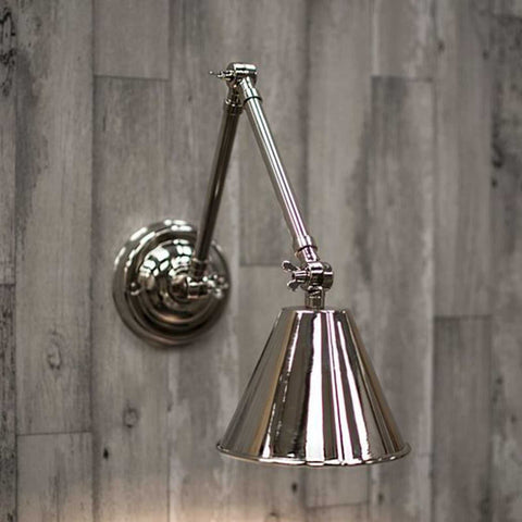 Henley Triple Adjustable Wall Light in polished nickel with three adjustable points mounted on wooden wall