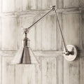 Pooky Stork Wall Light adjustable brass antique silver finish mounted on wooden panel wall