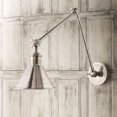 Pooky Stork Wall Light adjustable brass antique silver finish mounted on wooden panel wall