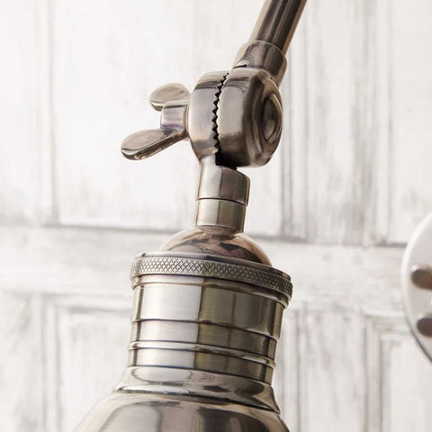 Close-up of the adjustable antique silver Pooky Stork Wall Light arm and fixture detail