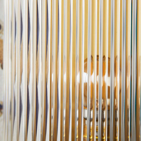 Close-up of clear glass rods on Pooky Roddy Wall Light showcasing Art Deco style and ambient light diffusion
