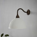 Denton Ribbed Ceramic medium white wall light with ribbed shade and antique brass arm