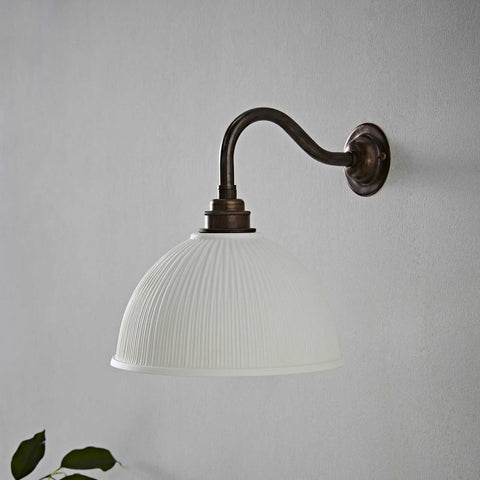 Denton Ribbed Ceramic medium white wall light with ribbed shade and antique brass arm
