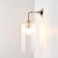 Brook Small Ribbed Glass Shade wall light with sleek ribbed glass and polished metal mount, ideal for elegant interior lighting.
