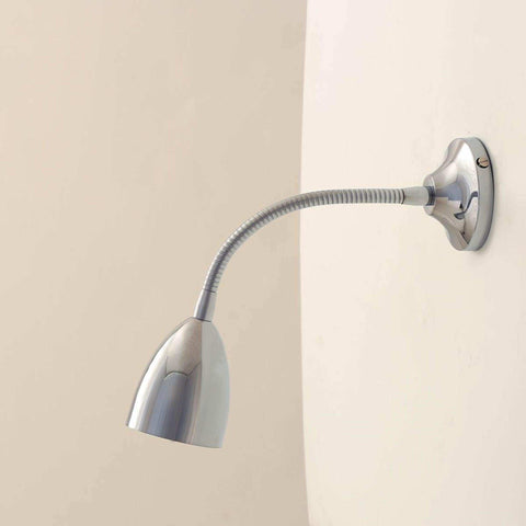 Huxley Adjustable Bedside Reading Light with sleek gooseneck and metallic finish mounted on bedroom wall