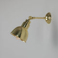 Moorlea brass adjustable wall light with vintage industrial design and flexible arm for focused indoor lighting