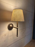 Finberry Fabric Shade Lupin wall light with beige waffle fabric shade and bronze finish mounted on wooden wall