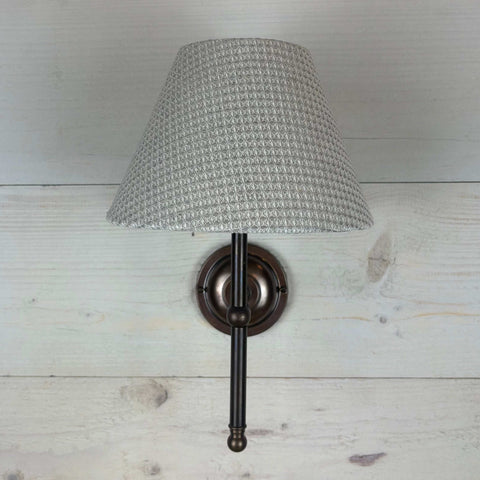 textured waffle empire shade, handmade in the uk 20cm. On an antique brass straight arm lupin fitting handcrafted in the UK.