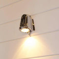 Bourne Outdoor Mast Light in chrome finish mounted on exterior wall illuminating pathway